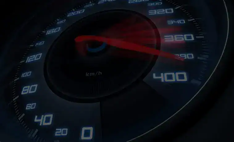High-speed car speedometer showing 390 km/h.